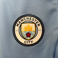 Ensemble enfant Manchester City FC 2024/2025 – Ensemble Domicile Enfant (Maillot + Short)